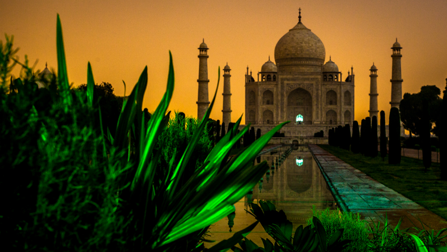 Taj_Mahal_in_Midnight_with_City_Lights_illuminating_the_background.jpg